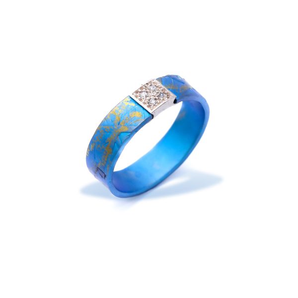 Statement Blue Anodized Titanium Promise Ring Textured With A Silver Bar With Two Rows Of 2 Zircons